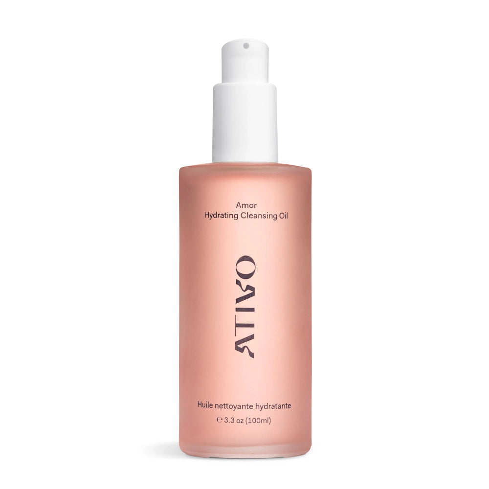 Pink Amor Hydrating Cleansing Oil in bottle sitting on a white background